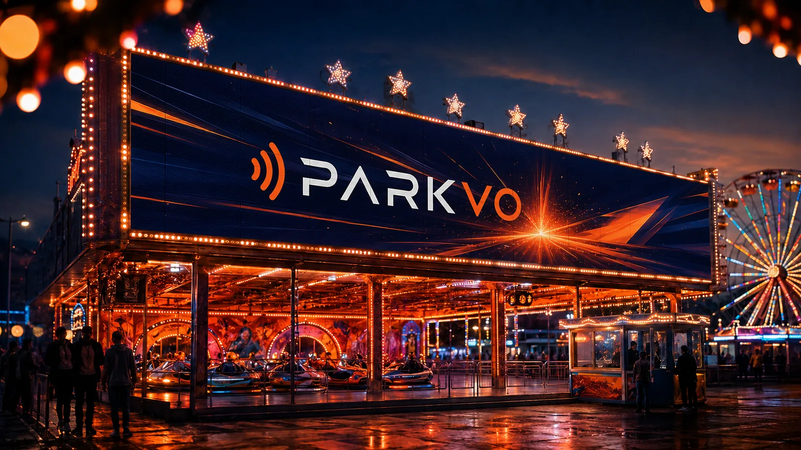 Große LED-Werbewand an einem beleuchteten Fahrgeschäft bei Nacht auf der Kirmes.
